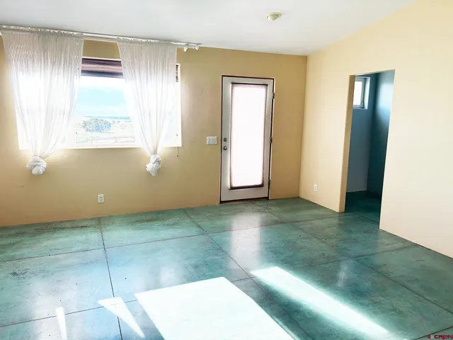 a view of a room has a window