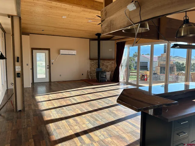 a view of a porch with a table and chairs
