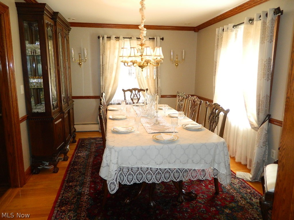 11735 Sperry Road Chesterland, OH 44026 - Photo 11 of 35 Elegant Dining Accented with Chair Rail and Crown Molding