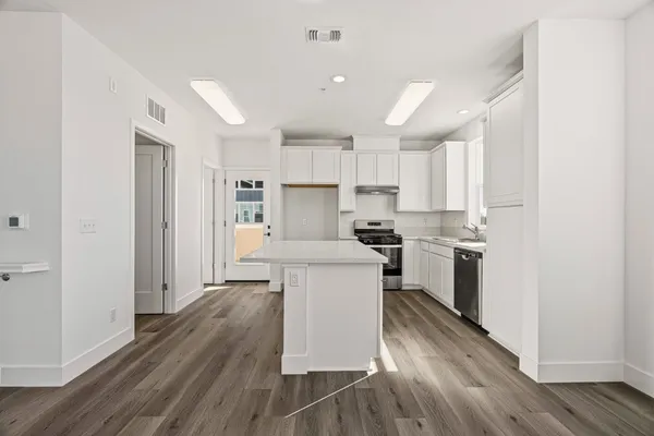 an empty room with large window