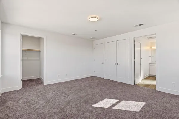 a spacious bathroom with a shower and a sink