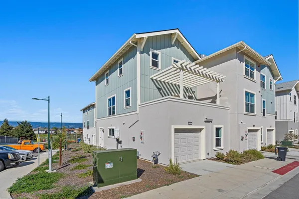an aerial view of a house with a ocean view