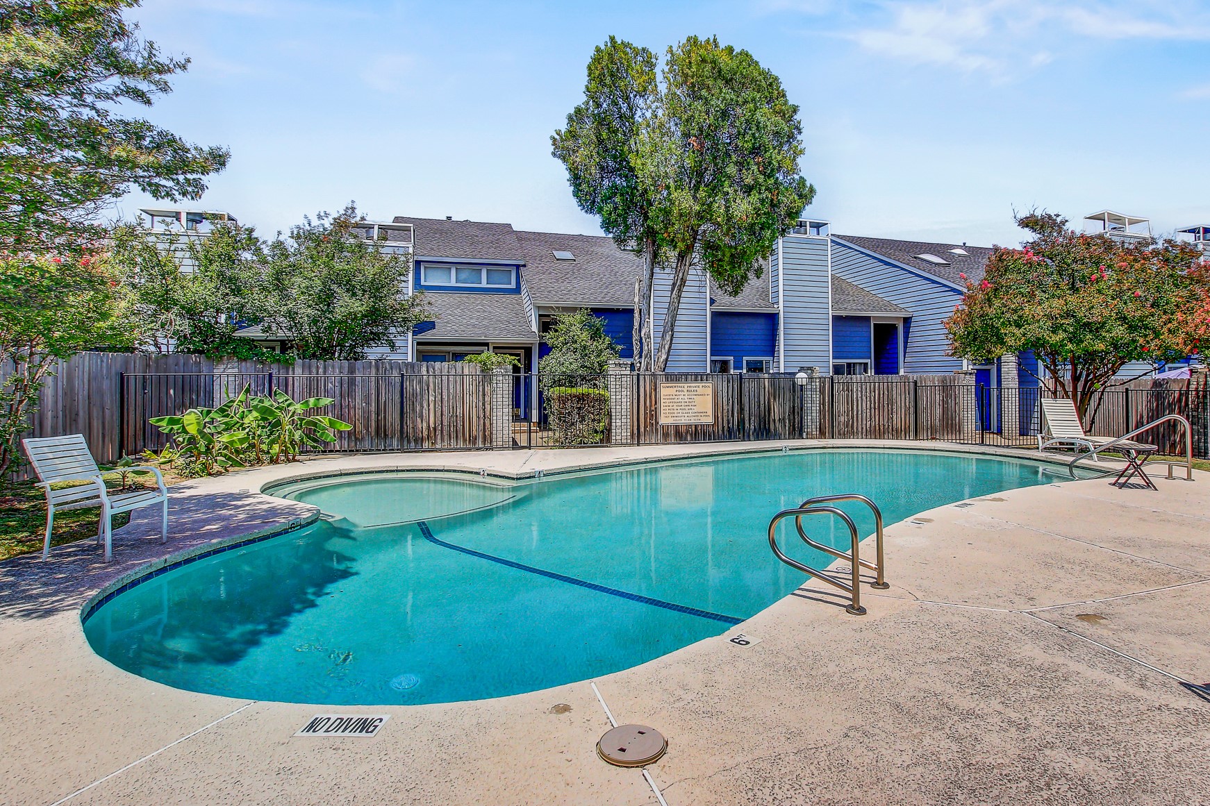 1010 West Rundberg Lane, Unit 24 Austin, TX 78758 - Photo 17 of 24 a view of a house with pool and a yard