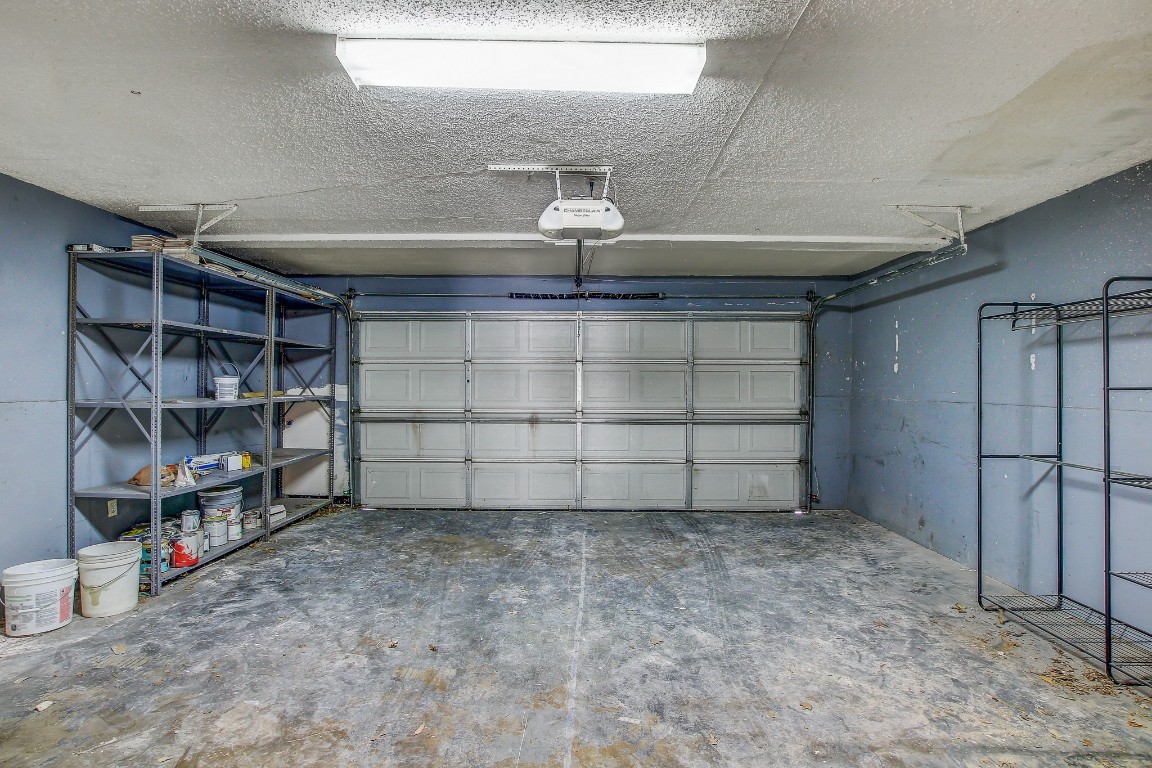 1010 West Rundberg Lane, Unit 24 Austin, TX 78758 - Photo 20 of 24 Garage with a garage door opener