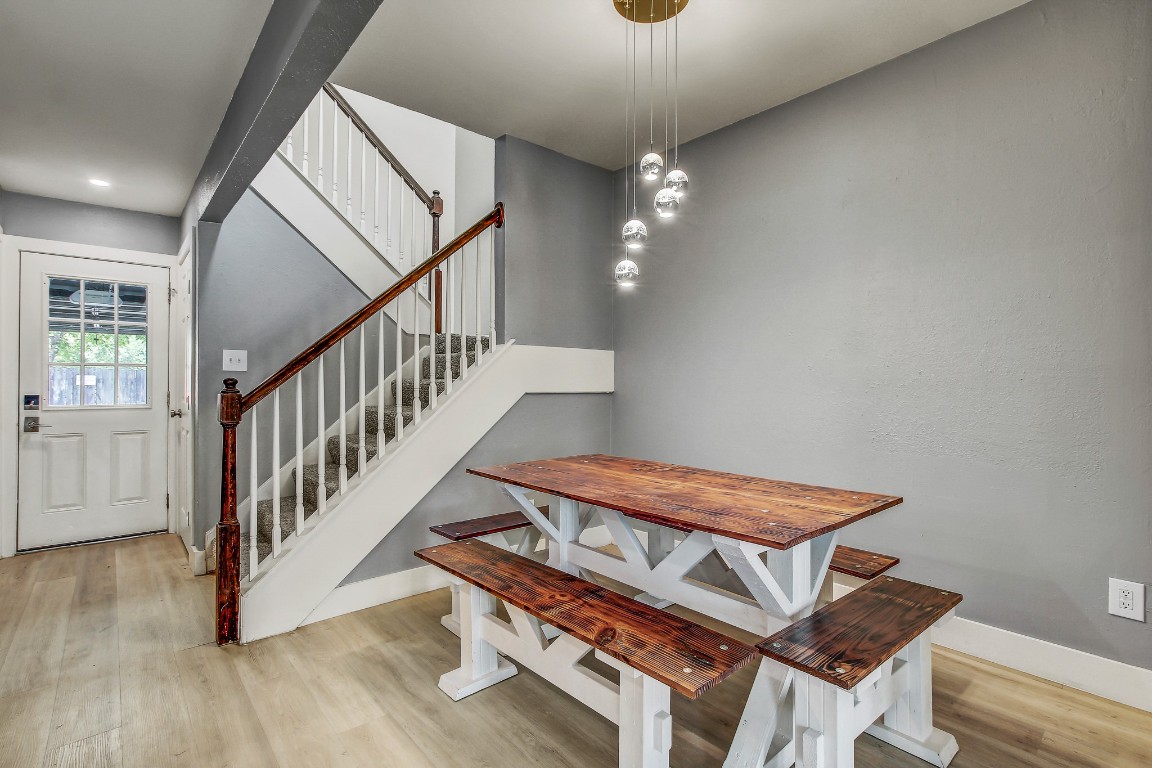 1010 West Rundberg Lane, Unit 24 Austin, TX 78758 - Photo 7 of 24 Dining space featuring wood finished floors, stairway, baseboards, and recessed lighting