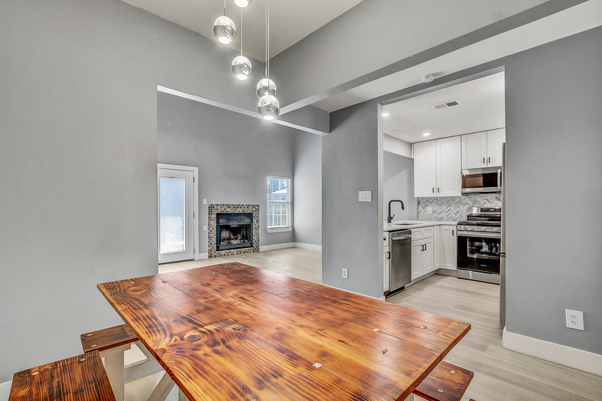 1010 West Rundberg Lane, Unit 24 Austin, TX 78758 - Photo 9 of 24 a room with kitchen island a sink stainless steel appliances and cabinets