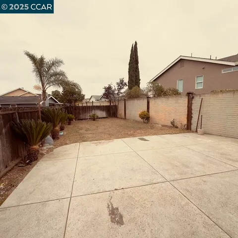 a view of a terrace with wooden fence