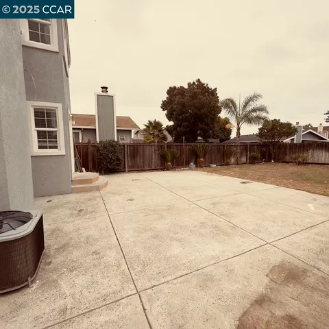 a swimming pool with buildings in the background