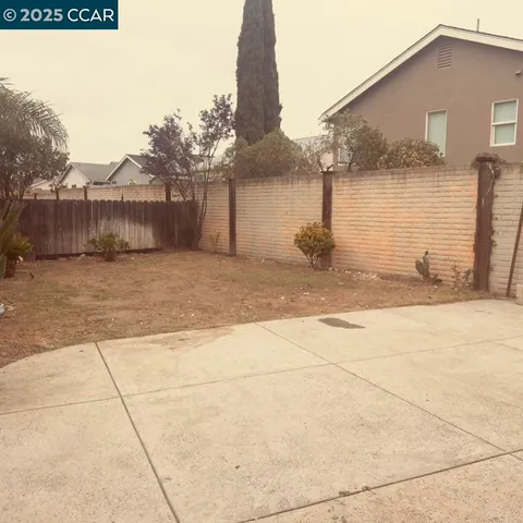 a view of a house with a street