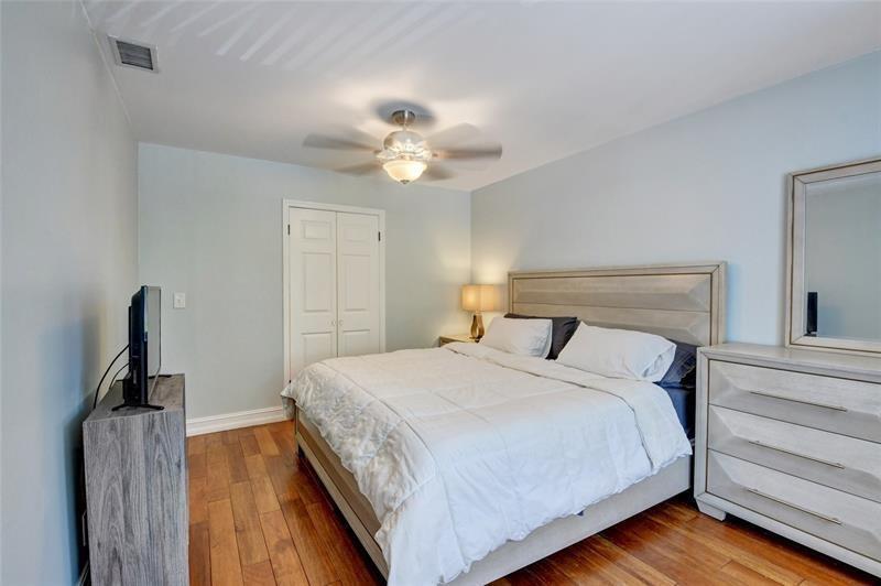 9316 Ketay Circle Boca Raton, FL 33428 - Photo 5 of 30 a bedroom with bed and a chandelier