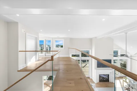 a view of a hallway with furniture
