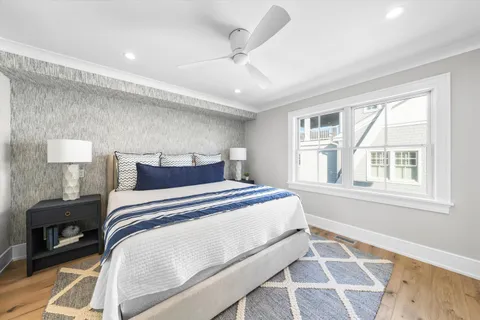 a bedroom with a large bed and a window