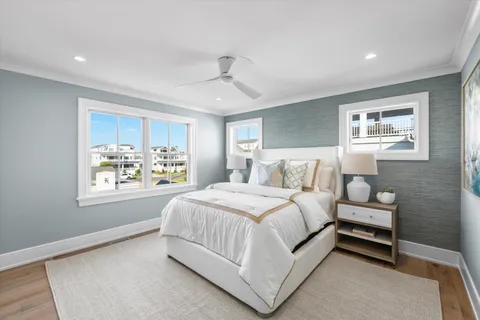 a bathroom with a granite countertop toilet a sink and a mirror