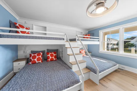 a bathroom with a granite countertop sink mirror and bathtub