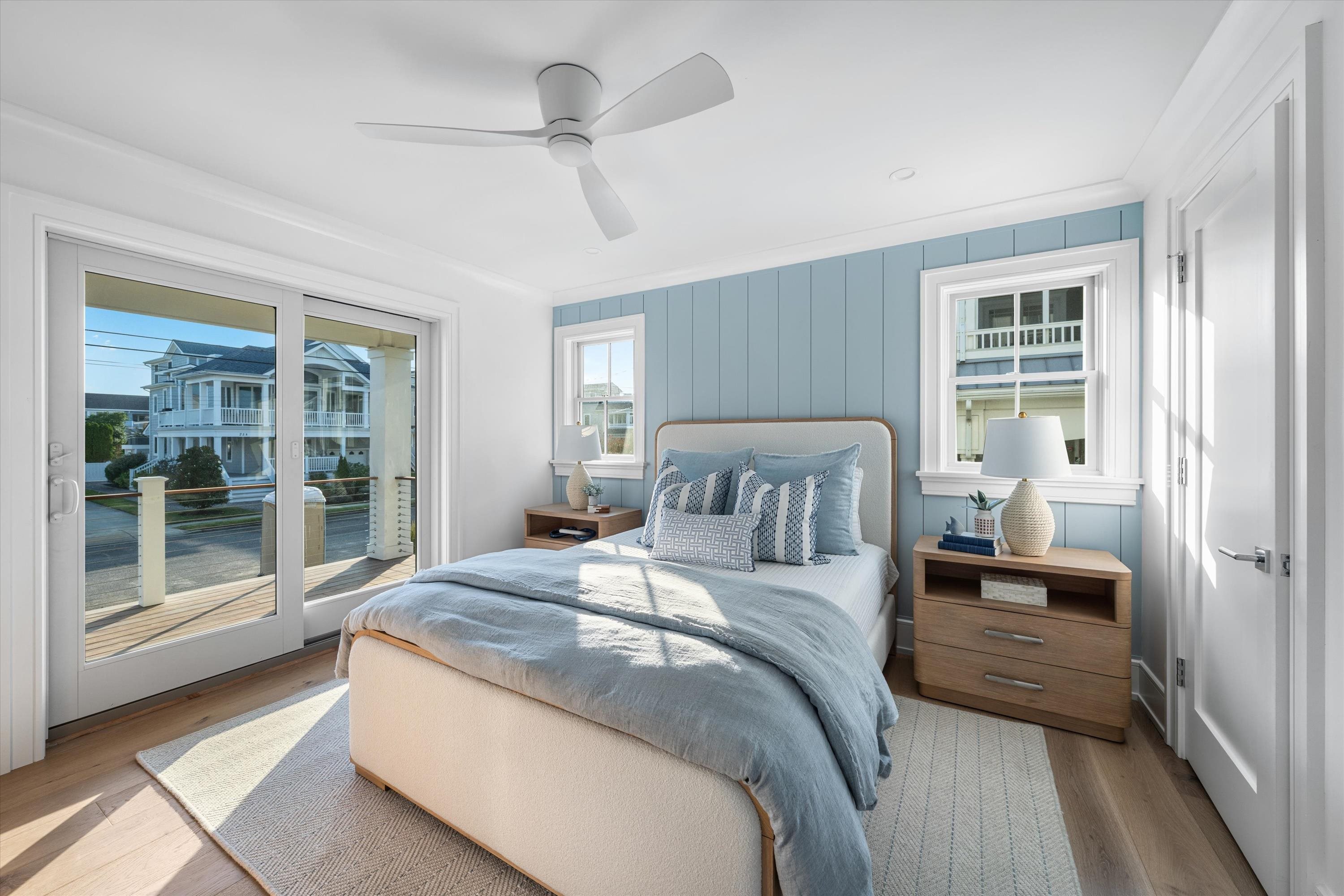 245 57th Street Avalon, NJ 08202 - Photo 29 of 50 a bedroom with a large bed and a large window