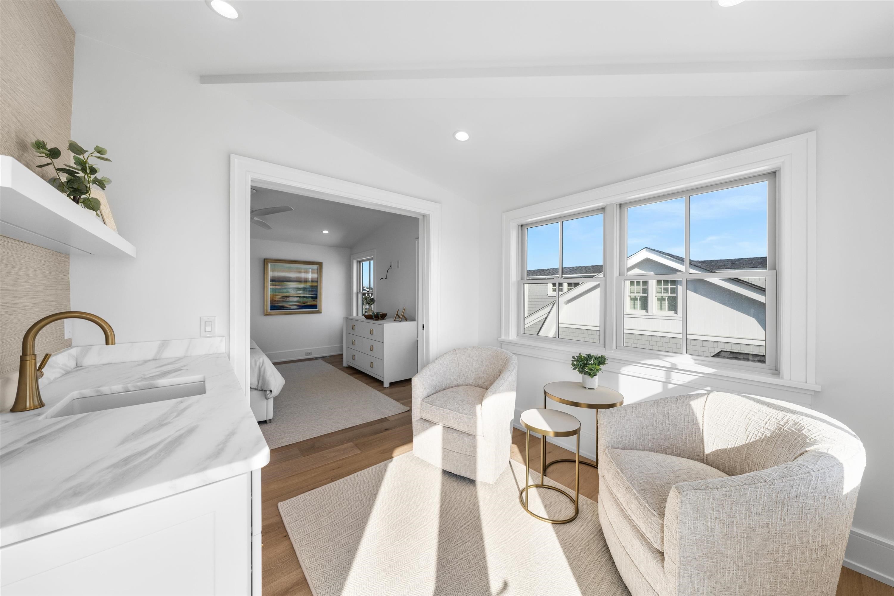 245 57th Street Avalon, NJ 08202 - Photo 33 of 50 a living room with furniture and a large window