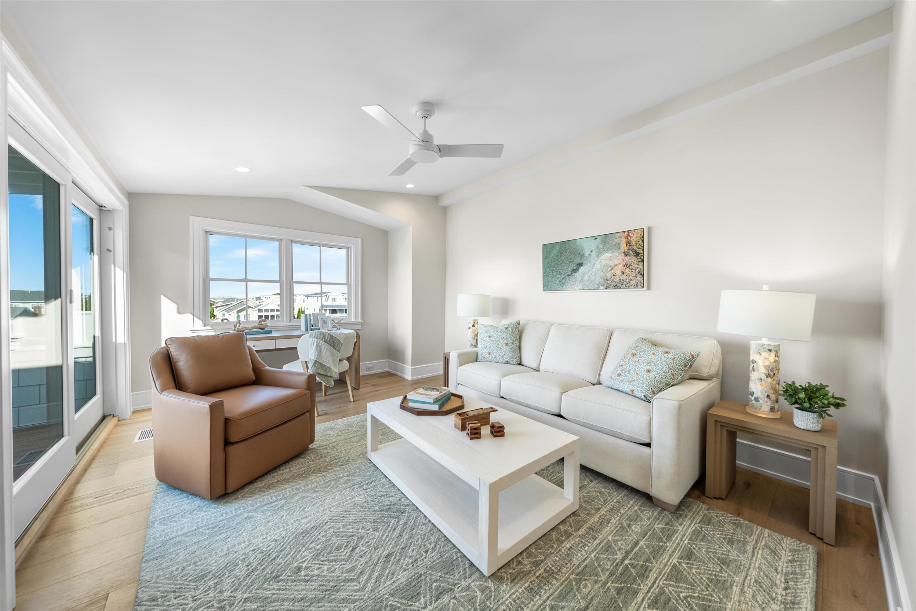 245 57th Street Avalon, NJ 08202 - Photo 39 of 50 a living room with furniture and a large window