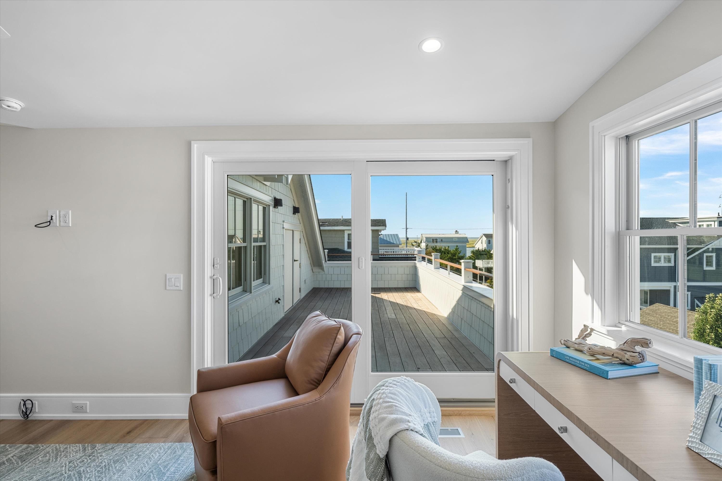 245 57th Street Avalon, NJ 08202 - Photo 40 of 50 a living room with furniture and a table