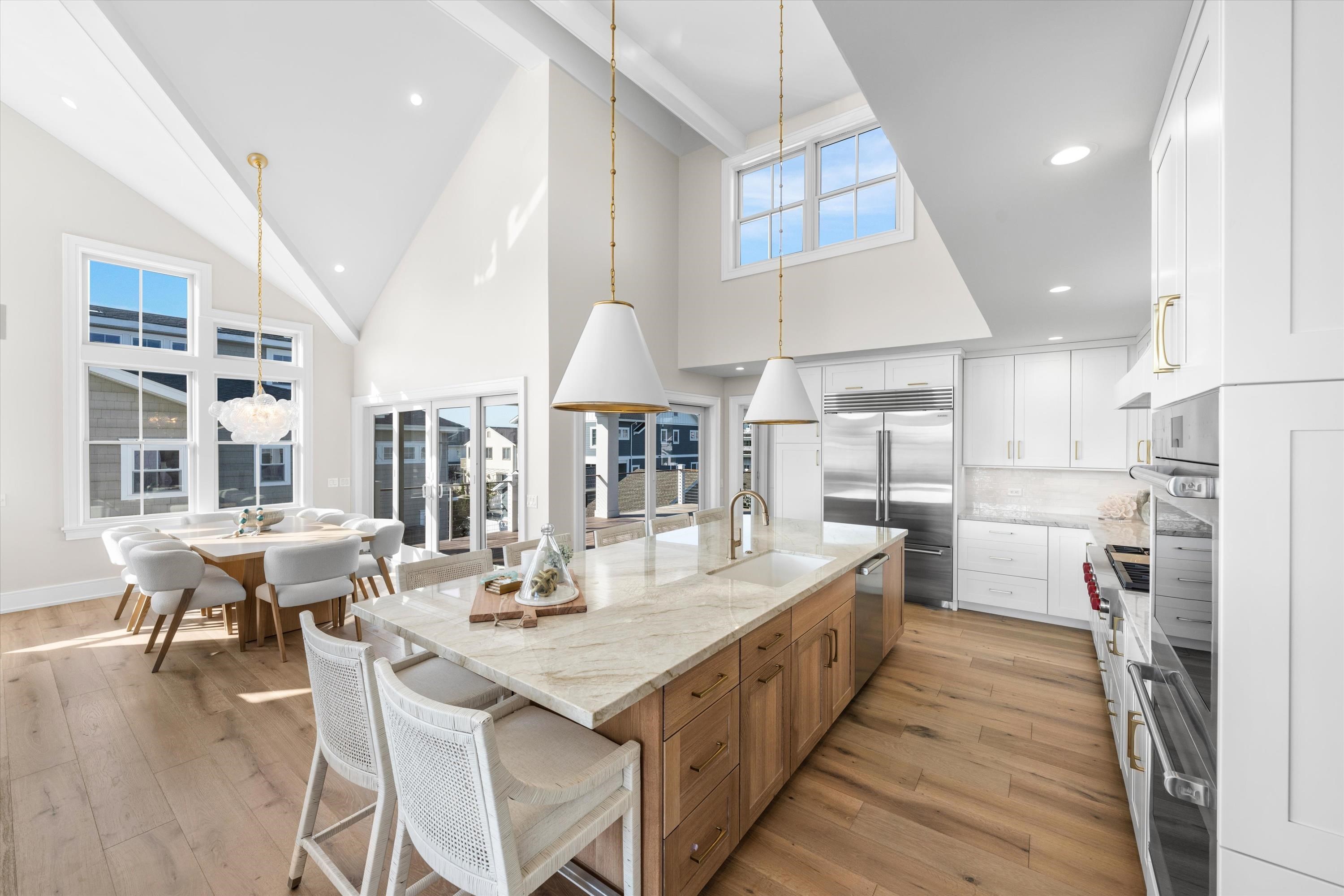 245 57th Street Avalon, NJ 08202 - Photo 6 of 50 a large kitchen with kitchen island a large island in it