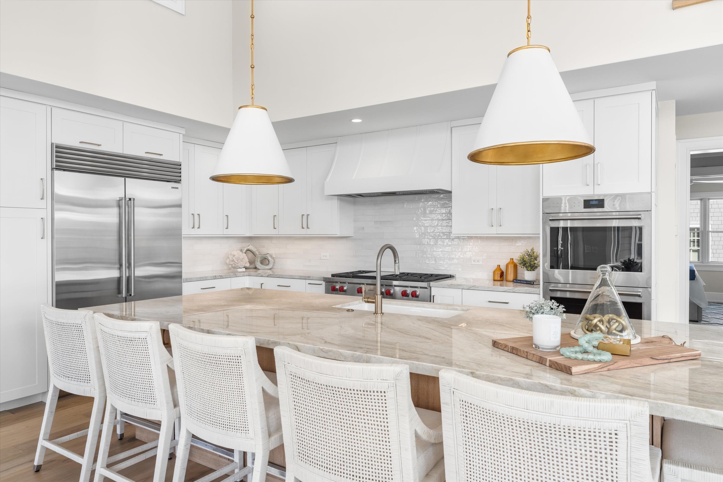 245 57th Street Avalon, NJ 08202 - Photo 8 of 50 a kitchen with stainless steel appliances granite countertop a sink a stove a refrigerator and island