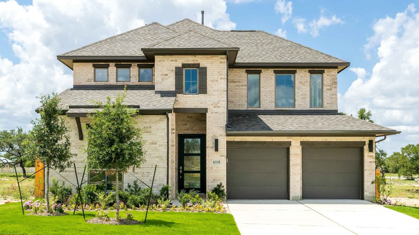 1009 Scenic Green Loop Georgetown, TX 78628 - Photo 1 of 1 a front view of a house with a yard