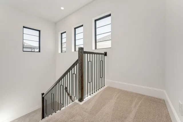 a view of hallway with windows