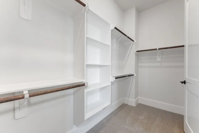 a view of an empty walk in closet