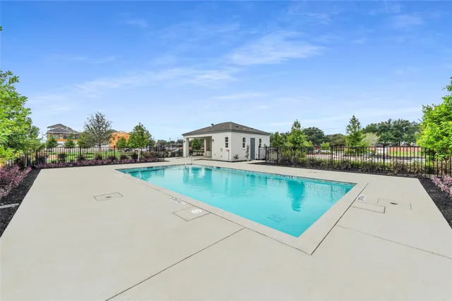 a swimming pool view with a outdoor space