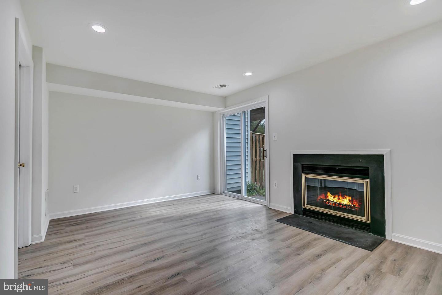 12110 Sweet Clover Drive Silver Spring, MD 20904 - Photo 12 of 13 a room with an empty room and fire place