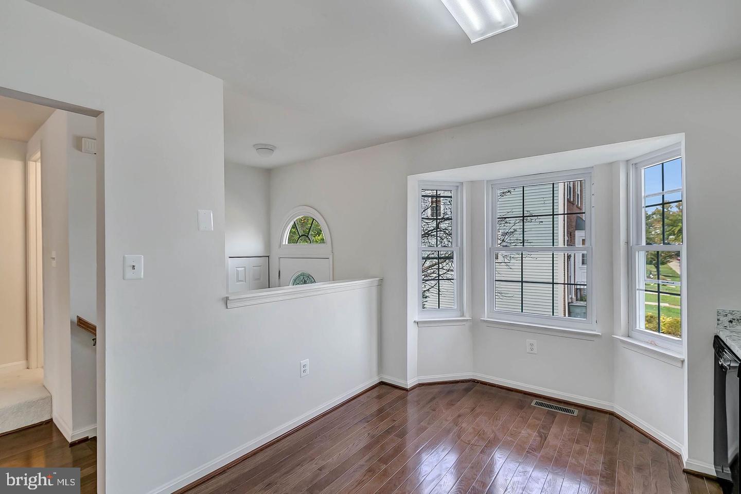 12110 Sweet Clover Drive Silver Spring, MD 20904 - Photo 2 of 13 an empty room with windows and cabinet