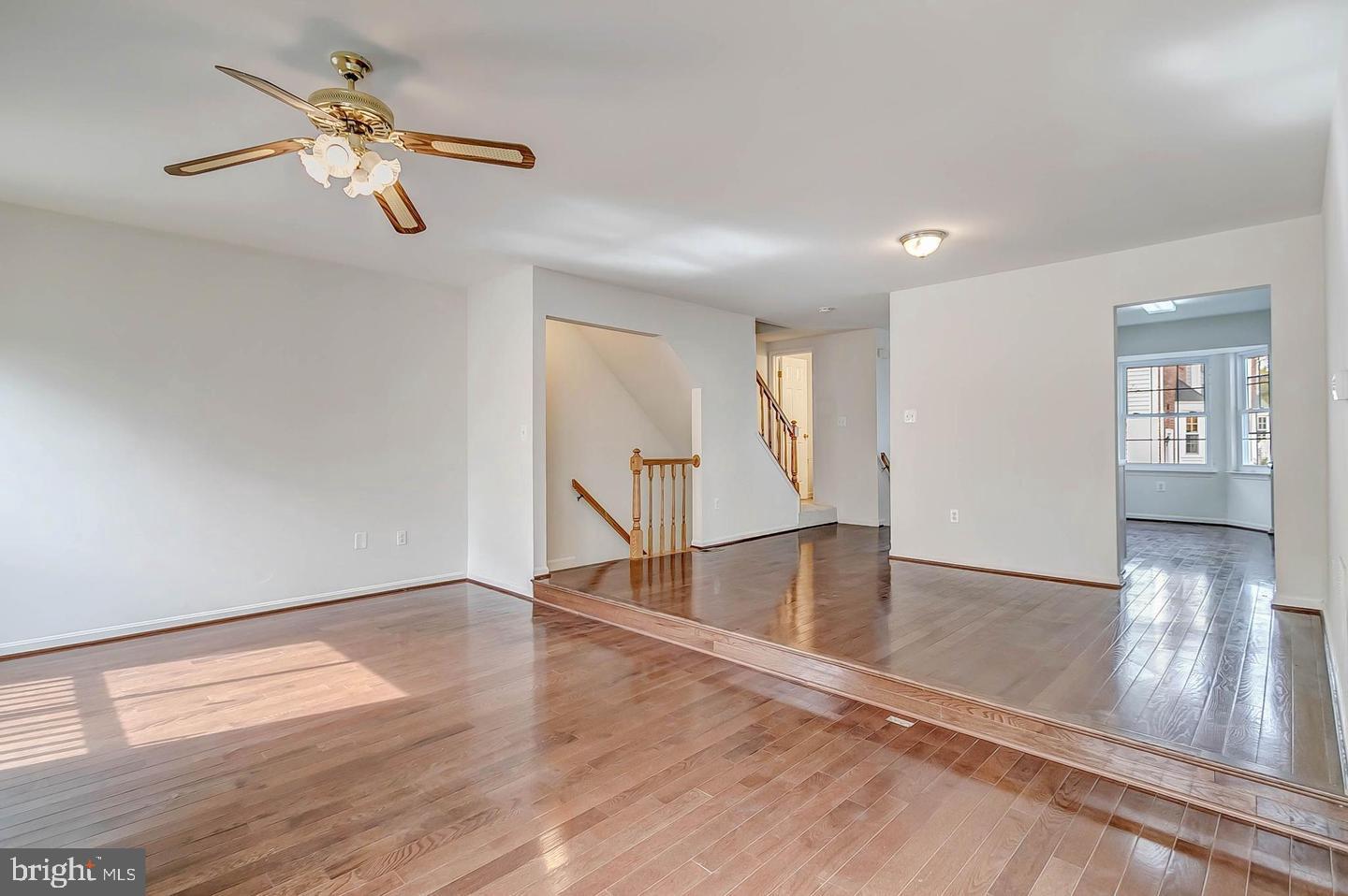 12110 Sweet Clover Drive Silver Spring, MD 20904 - Photo 4 of 13 wooden floor in an empty room with a window
