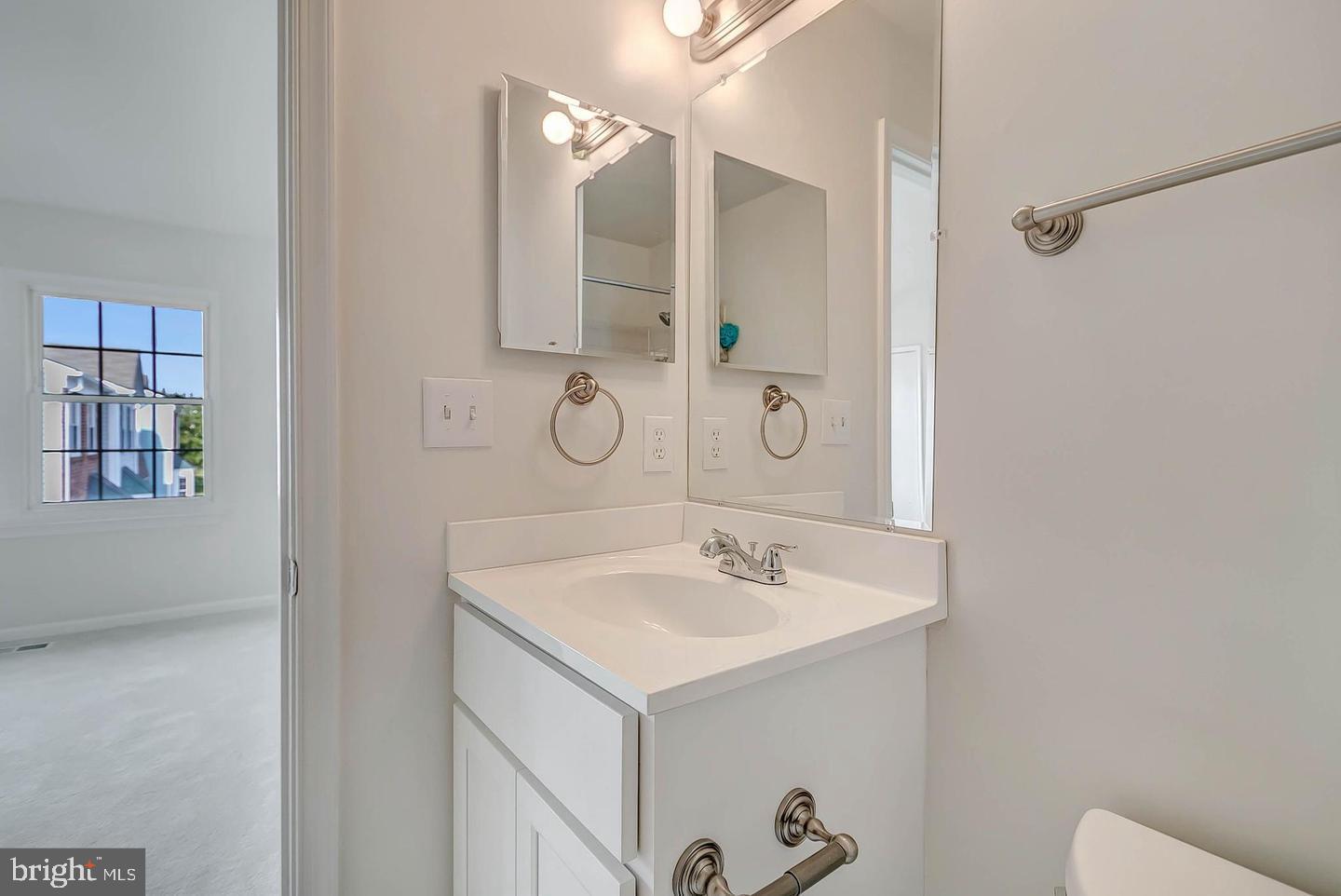 12110 Sweet Clover Drive Silver Spring, MD 20904 - Photo 8 of 13 a bathroom with a sink and mirror