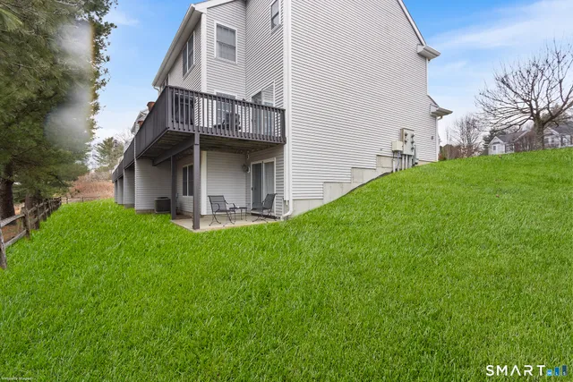 a view of house with backyard