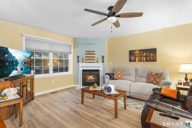 a living room with furniture and a fireplace