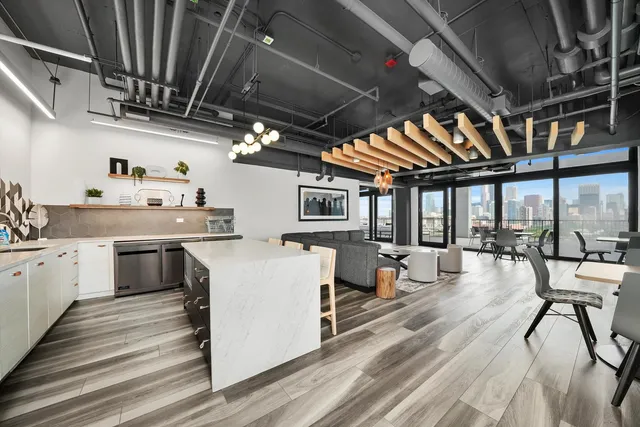 a kitchen with sink cabinets and wooden floor