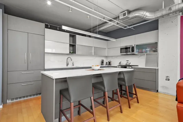 a kitchen with a sink cabinets and window