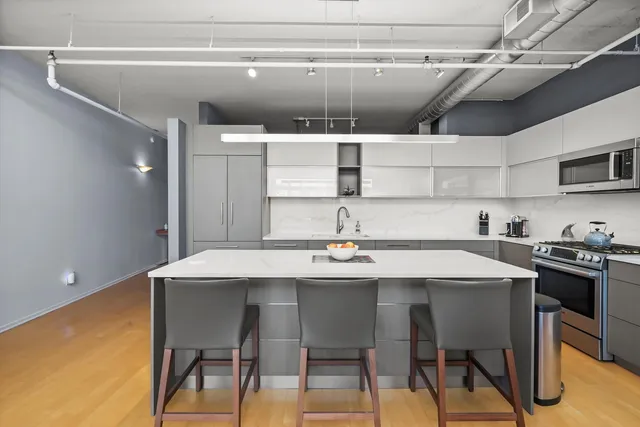 a kitchen with a table and chairs in it