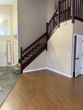 a view of entryway with wooden floor