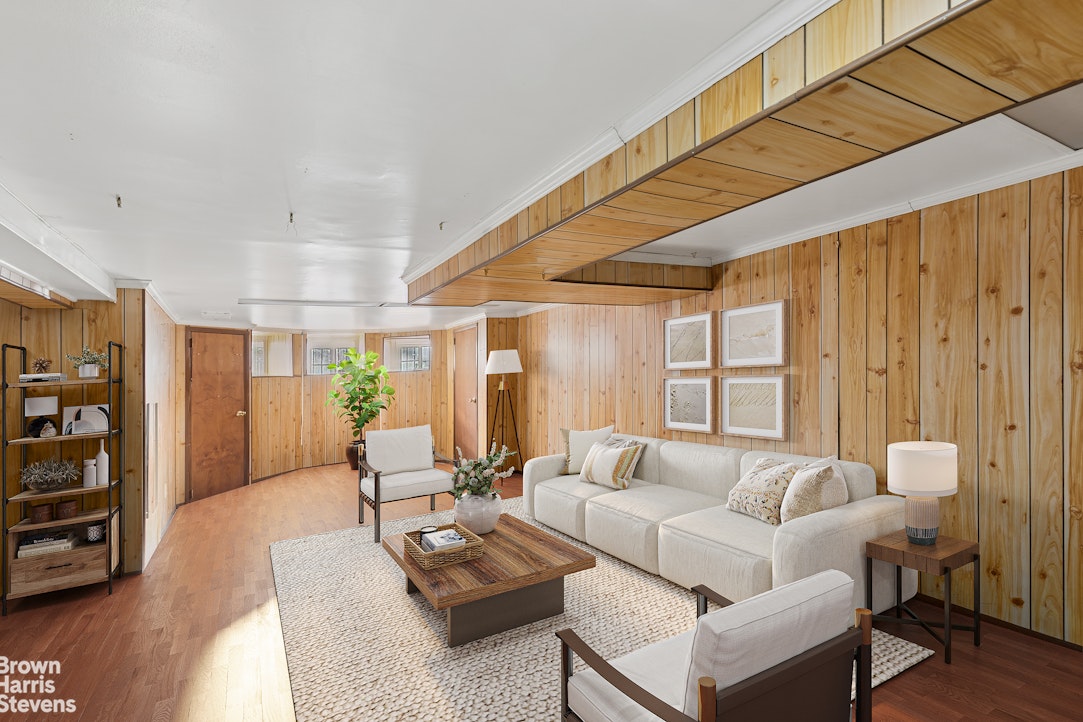251 Rutland Road Brooklyn, NY 11225 - Photo 12 of 16 a living room with furniture and a large window