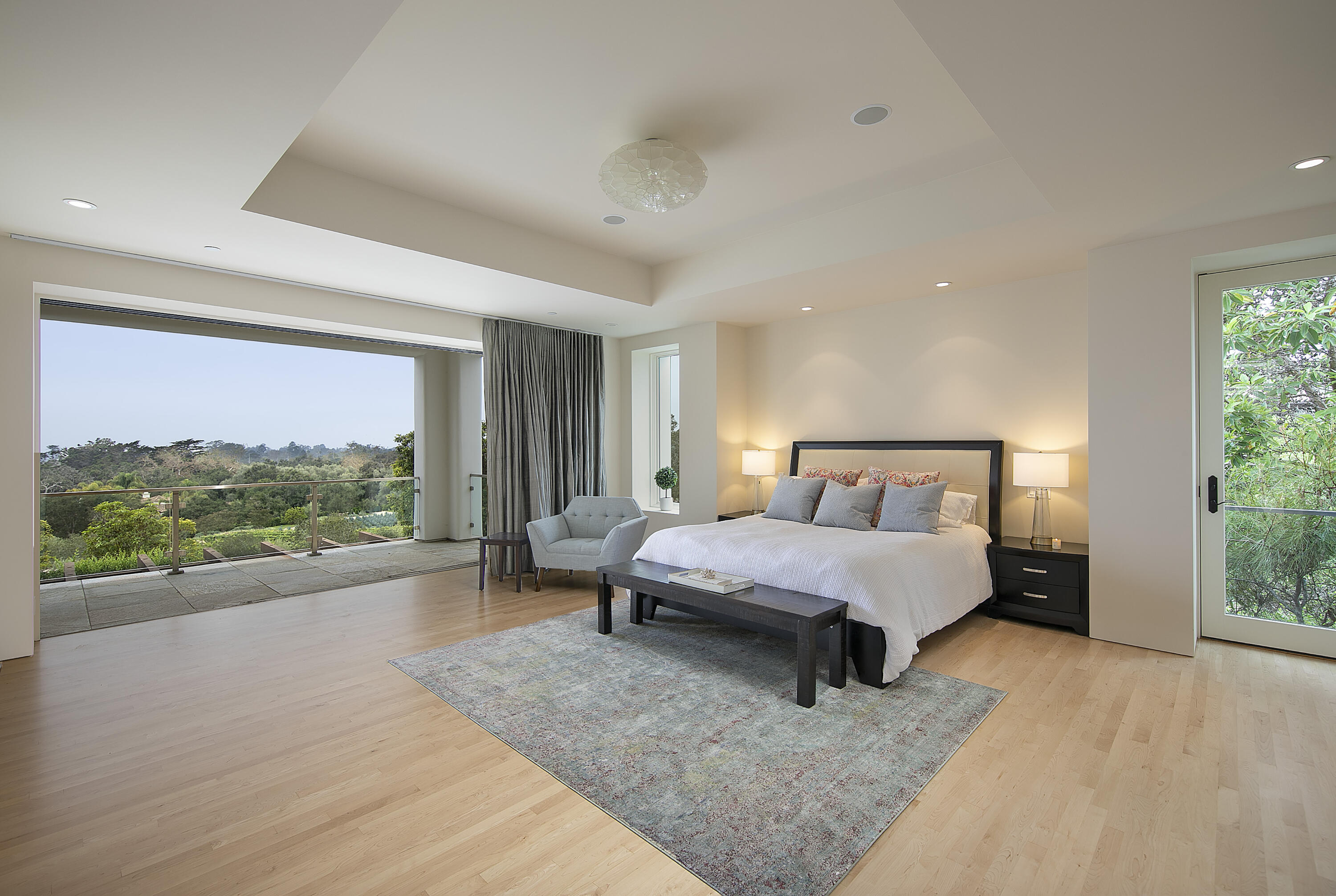 303 Meadowbrook Drive Santa Barbara, CA 93108 - Photo 12 of 28 a spacious bedroom with a bed and large windows