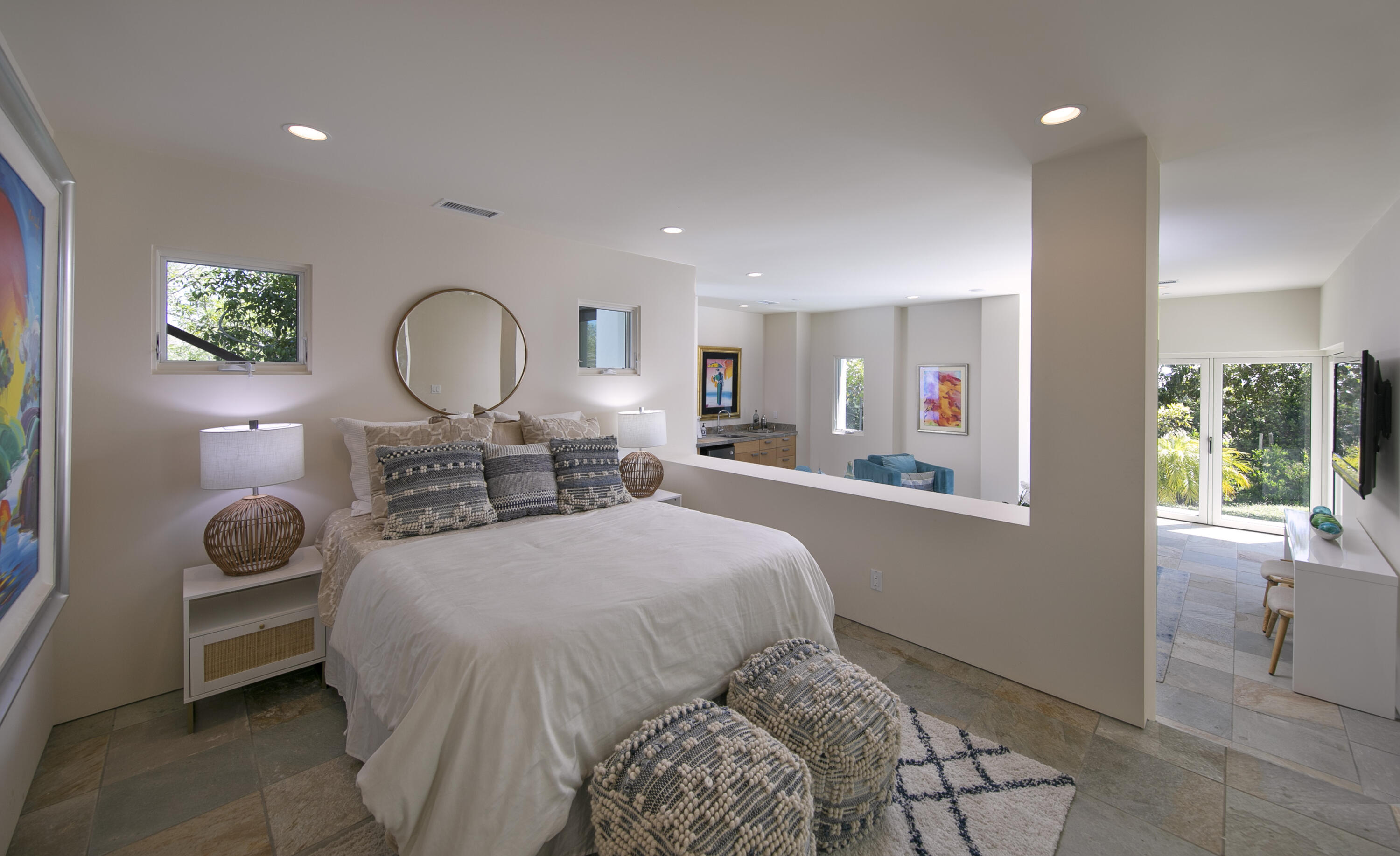 303 Meadowbrook Drive Santa Barbara, CA 93108 - Photo 22 of 28 a bedroom with a bed a mirror and a large window