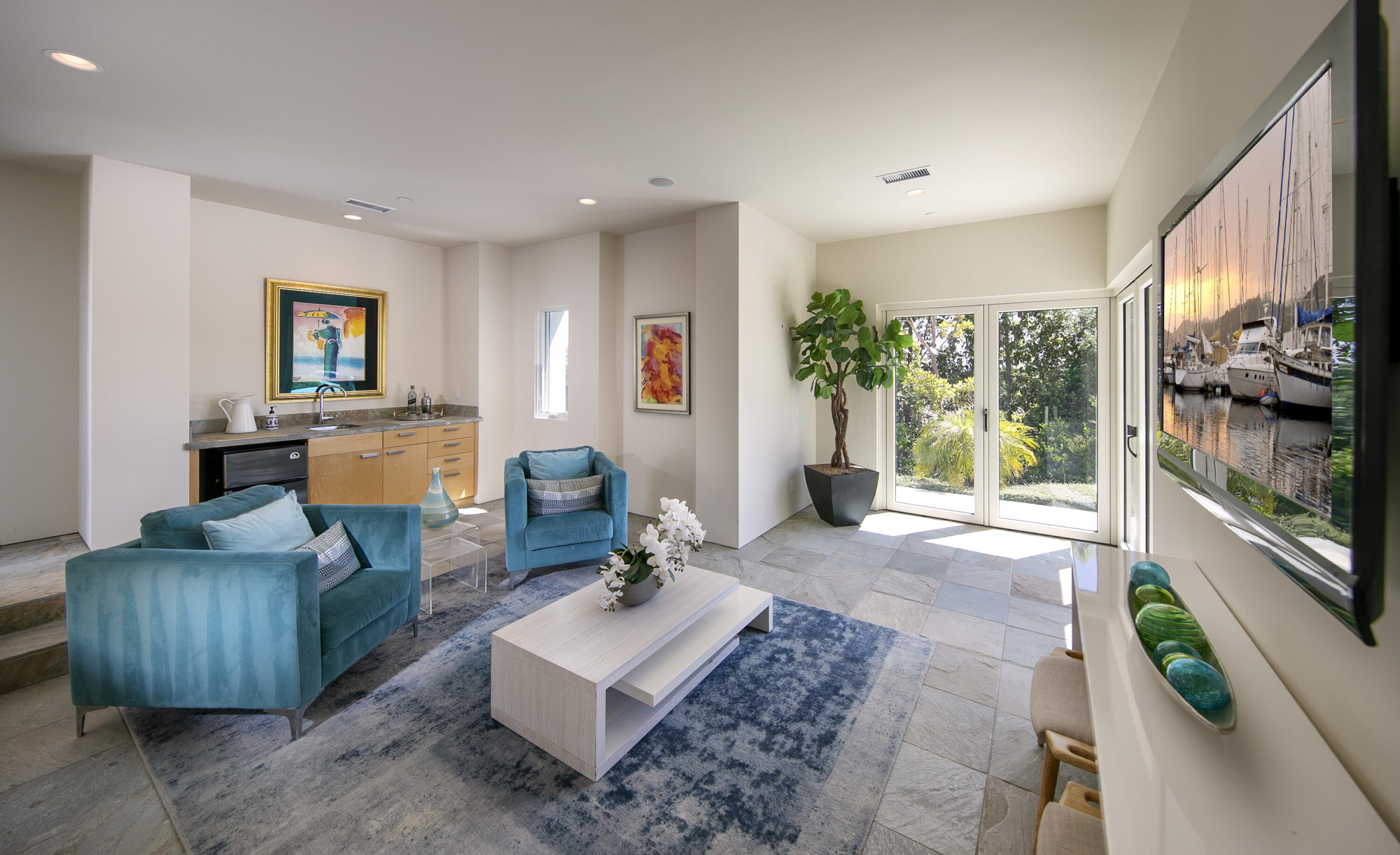 303 Meadowbrook Drive Santa Barbara, CA 93108 - Photo 24 of 28 a living room with furniture and a flat screen tv