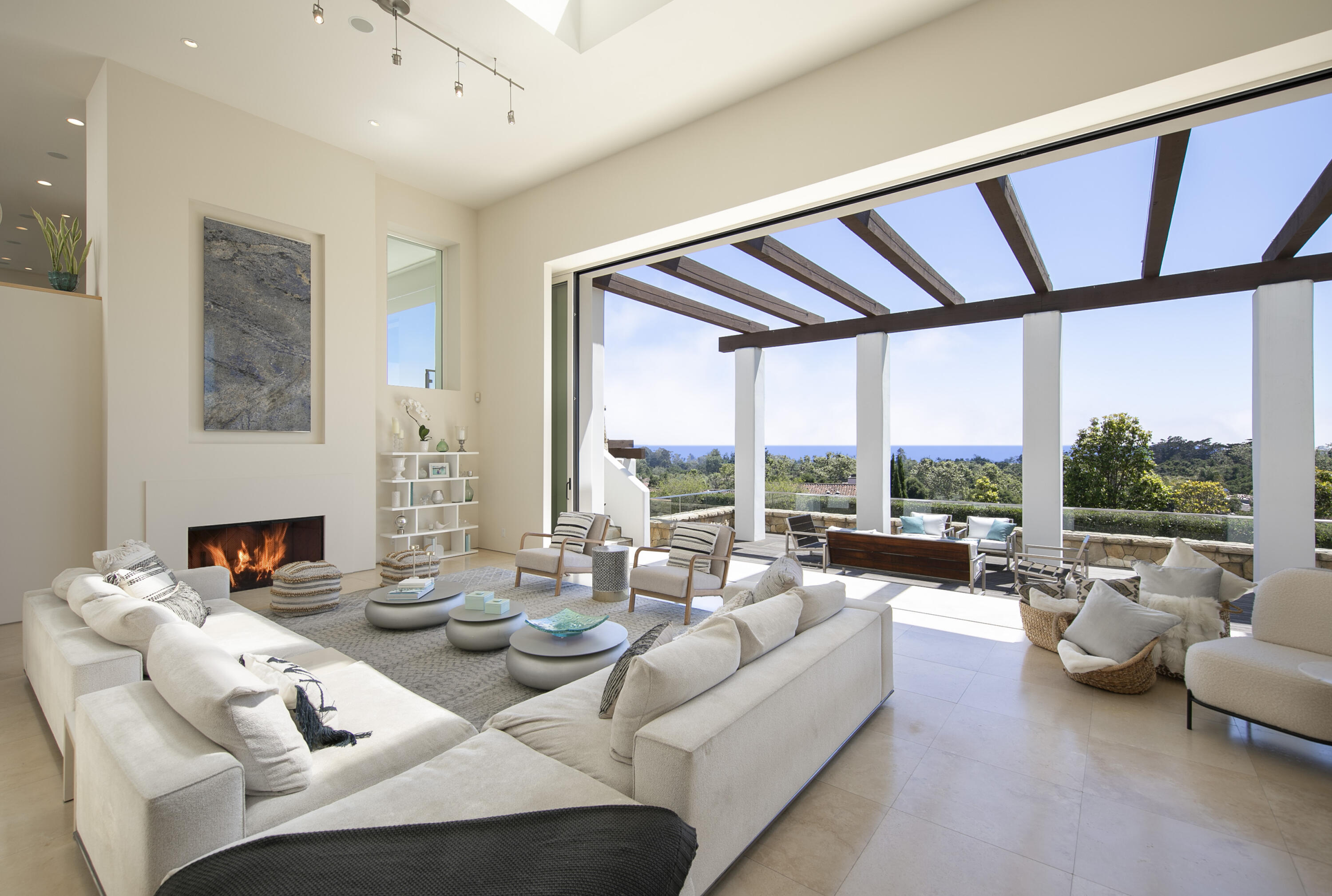303 Meadowbrook Drive Santa Barbara, CA 93108 - Photo 5 of 28 a living room with furniture and a floor to ceiling window
