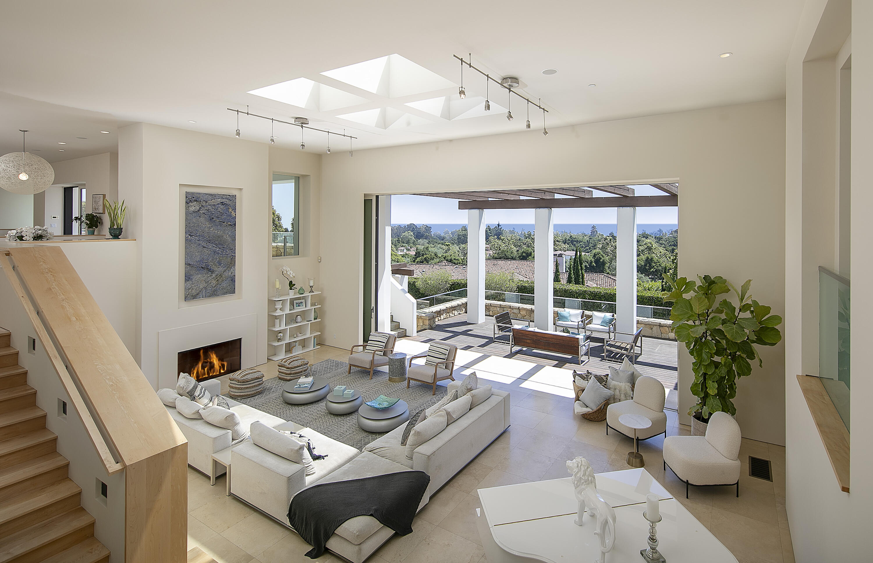 303 Meadowbrook Drive Santa Barbara, CA 93108 - Photo 6 of 28 a living room with furniture fireplace and a large window