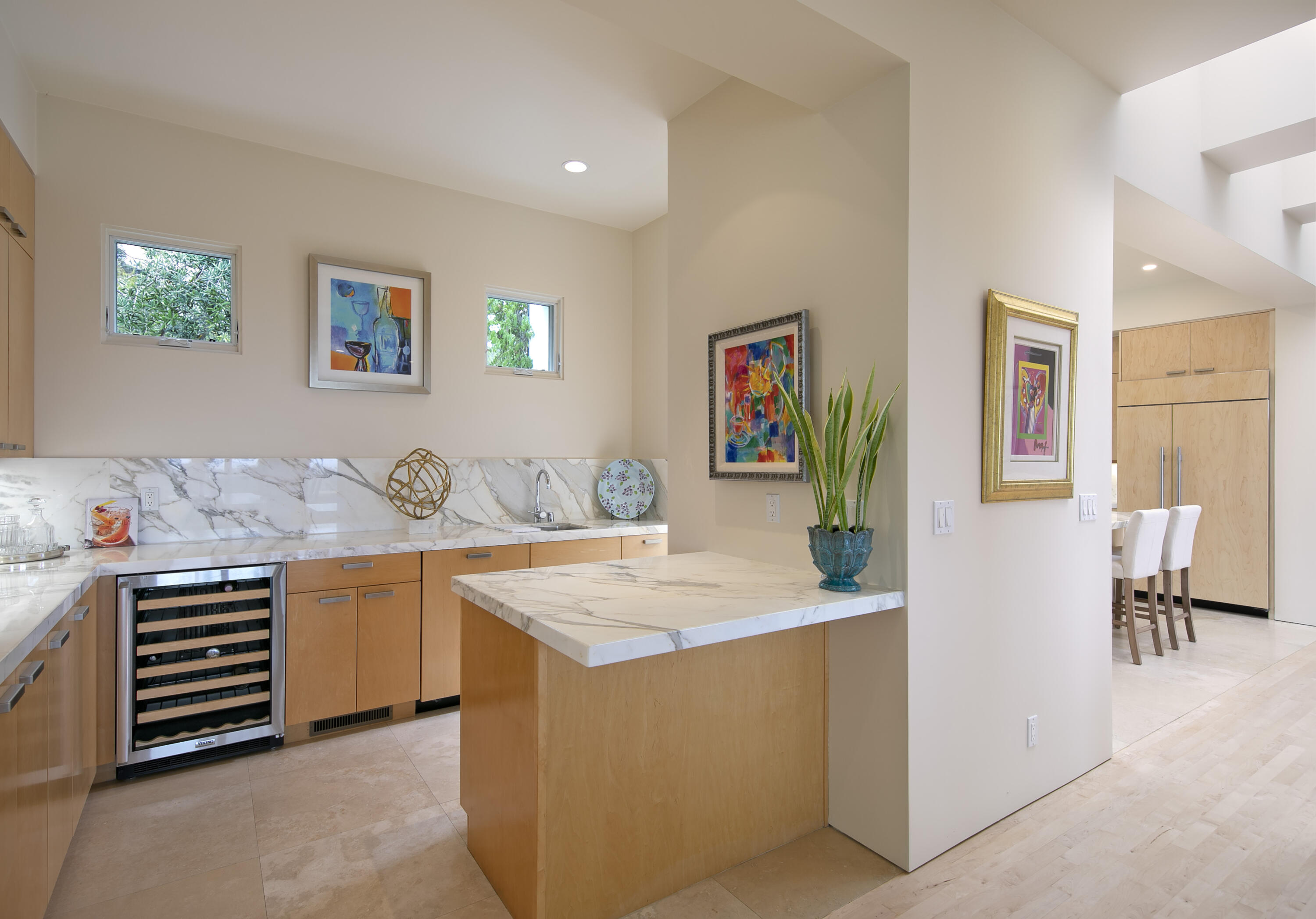 303 Meadowbrook Drive Santa Barbara, CA 93108 - Photo 8 of 28 a room with kitchen island a stove a table and chairs