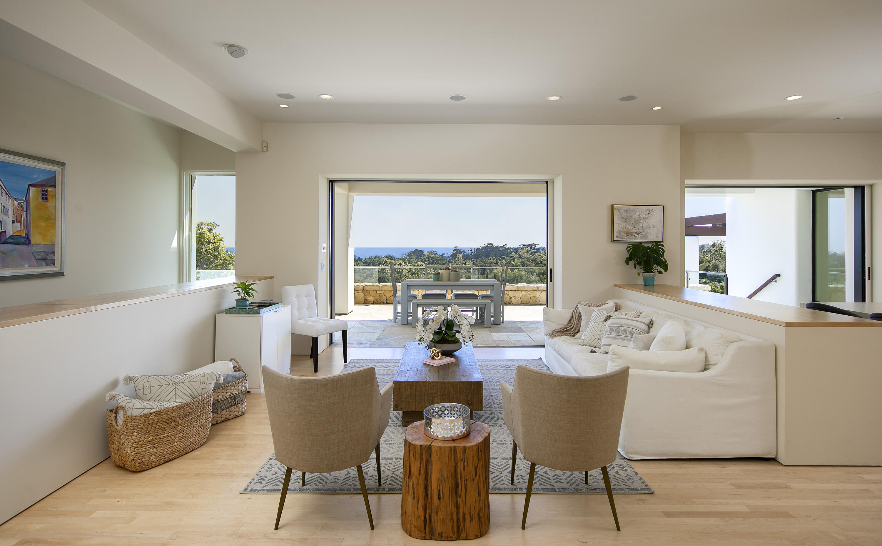 303 Meadowbrook Drive Santa Barbara, CA 93108 - Photo 9 of 28 a dining room with furniture a couch and wooden floor