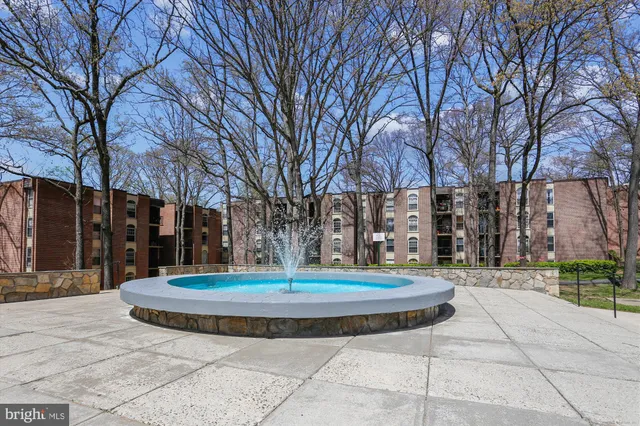 a view of house with yard and green space