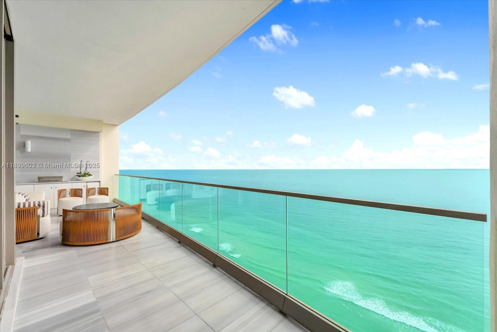 17901 Collins Avenue, Unit 3103 Sunny Isles Beach, FL 33160 - Photo 16 of 38 a balcony with view of an ocean