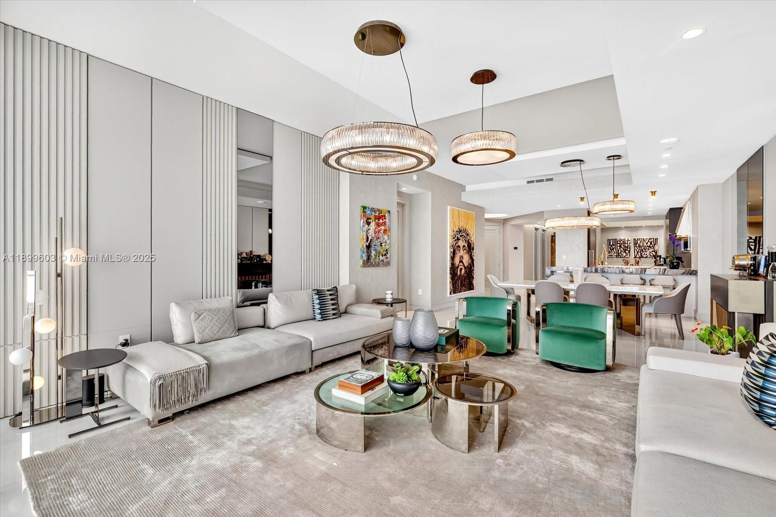 17901 Collins Avenue, Unit 3103 Sunny Isles Beach, FL 33160 - Photo 2 of 38 a living room with furniture and a chandelier