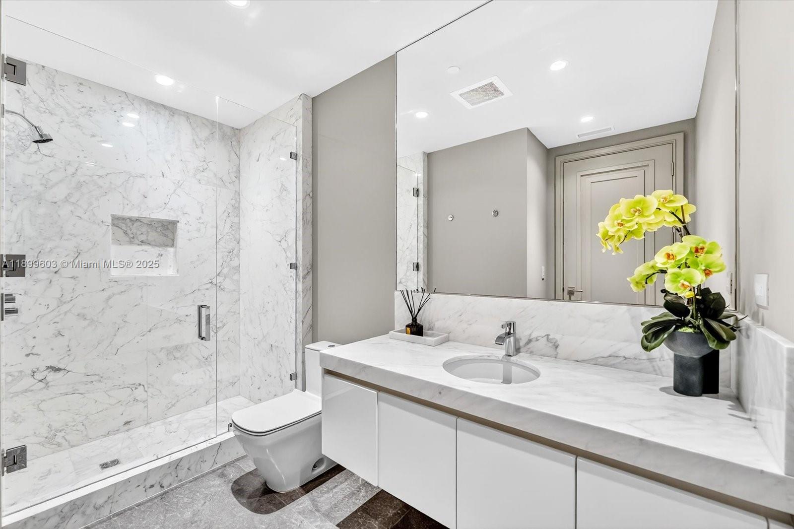 17901 Collins Avenue, Unit 3103 Sunny Isles Beach, FL 33160 - Photo 28 of 38 a bathroom with a sink a toilet and a shower